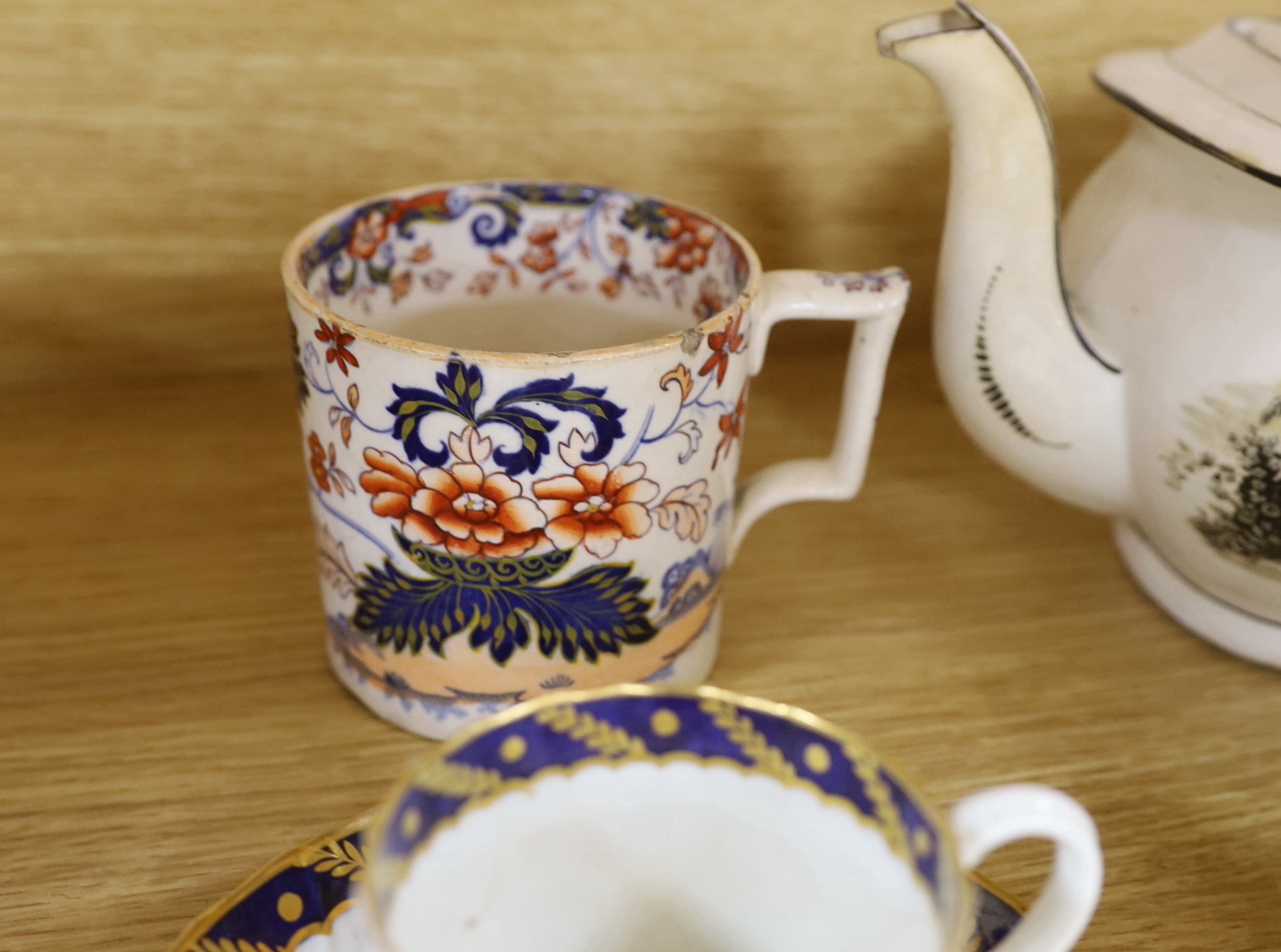 Collection of 18th century and Regency porcelain tea and coffee ware including teapots hand painted with flowers, cup and saucer with gilt decoration and a Philip Christian Liverpool sauceboat the largest 24cm wide